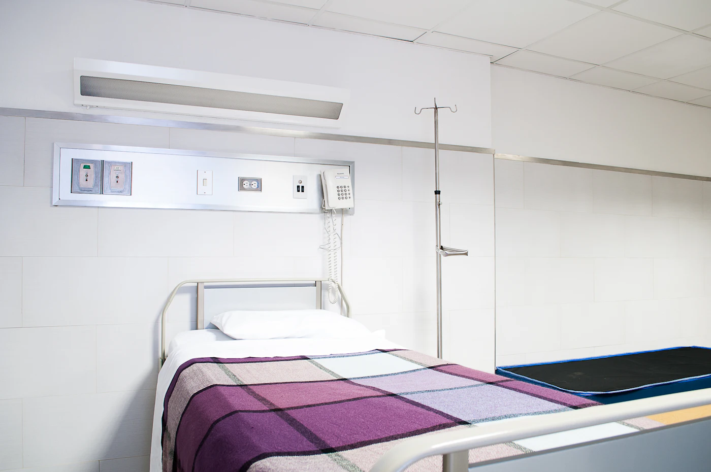 empty hospital bed — photo by Martha Dominguez de Gouveia on Unsplash